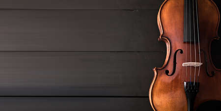 beautiful violin on black wooden backgroundの写真素材