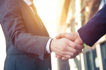People shake hand greeting teamwork in streetの写真素材