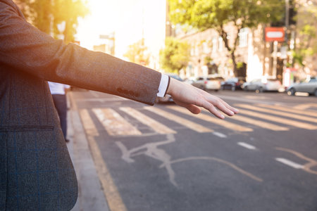 Closeup of Hand sign call a car.の写真素材