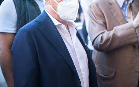 businessman in medical mask in streetの写真素材