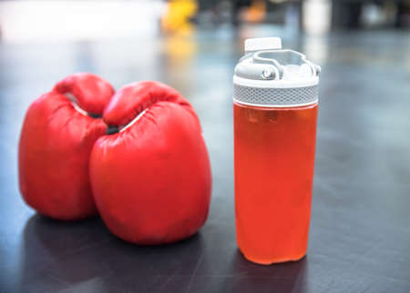 boxing gloves with bottle of water