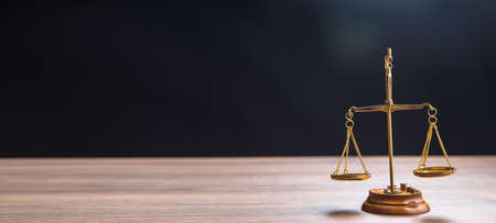 Law scales on table. Symbol of justiceの写真素材