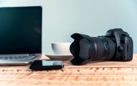 smart phone with camera and computer on tableの写真素材