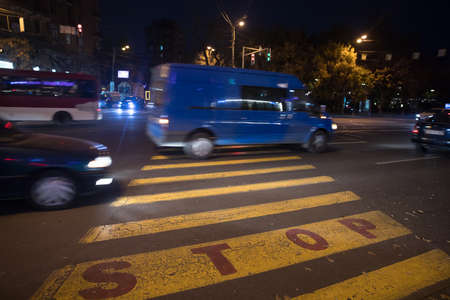 Car Speeding in the night cityの写真素材