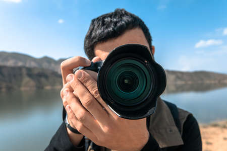 photographer takes photo on the mountainの写真素材