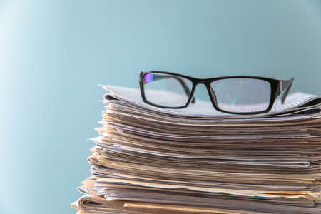 Morning news concept - newspaper and glasses with copy spaceの写真素材
