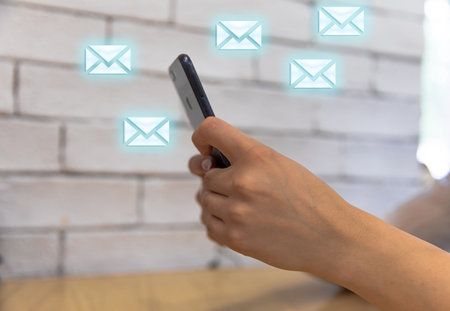 business woman presses message on phone screenの写真素材