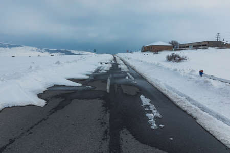 Winter background foreground road covered with snow and iceの写真素材