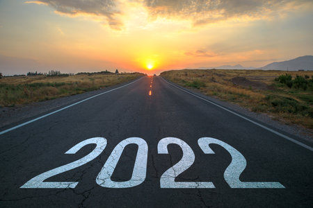 2022 on asphalt road at the sunset