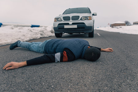 Man hit by a car is lying unconscious