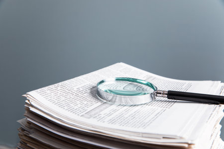 magnifying glass on the newspaperの写真素材