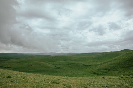 Dark heavy clouds over the green valley