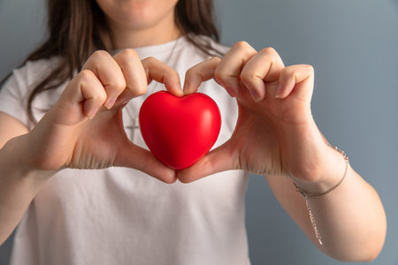 love concept, woman holding red heartの写真素材