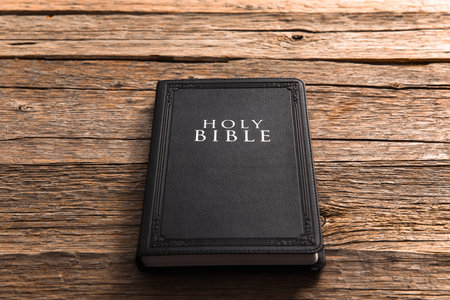 Holy Bible on the wooden table.