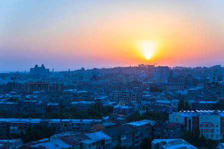 buildings in the city at the sunset backgroundの写真素材