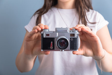 woman hand holding vintage cameraの写真素材