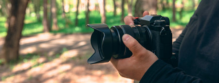 Photographer holding a camera in natureの写真素材