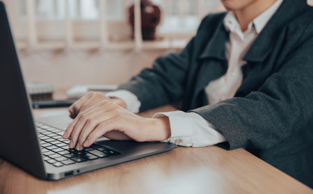 businesswoman working with laptop on desktopの写真素材