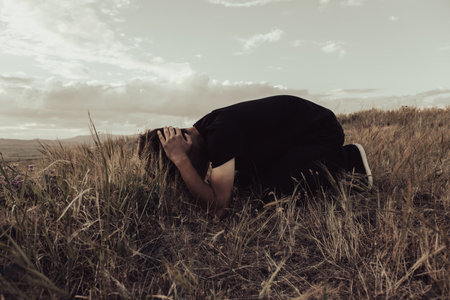 Man bowed his head to the ground in depressionの写真素材