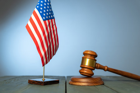 Judge's gavel and flag of america on the tableの写真素材