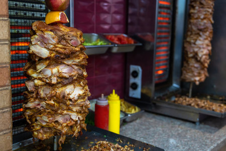 Doner meat on a rotating spit. Cooking Shawarmaの写真素材