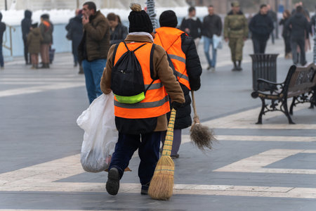 City cleaners in uniform walk aroundの写真素材
