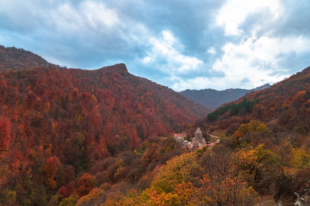 Ancient Monastery in the autumn forest. Armenian Church of Haghartsin in the gorgeの写真素材