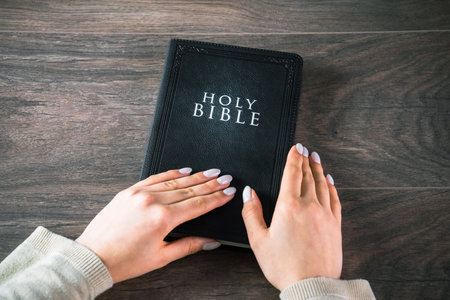 Women's hands on the bible. believerの写真素材