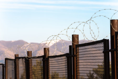 Fence with metal wire during the dayの写真素材