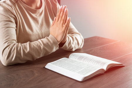 woman praying on the bible. believer