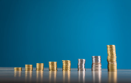 Coins in order of growth on the tableの写真素材