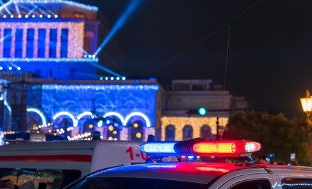 Police car stands in the city at nightの写真素材