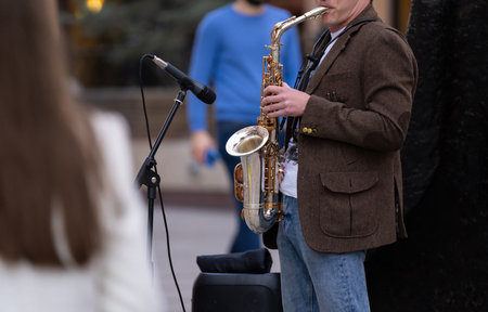 Street musician playing in the streetの写真素材