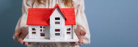 Property insurance and security concept.Real estate agent offer houseの写真素材