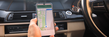 driver holding smart phone with navigation on screen