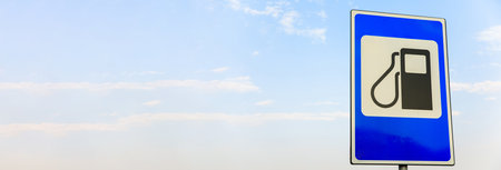 Refueling road sign for fueling cars of different typesの写真素材