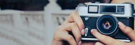 woman holding vintage cameraの写真素材
