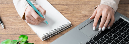 woman working in notepad in the officeの写真素材