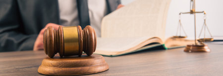 Male lawyer or judge working with Law books in office