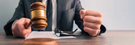 justice and law concept.Male judge in a courtroom with the gavelの写真素材