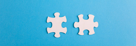 Two puzzle pieces. teamwork and business strategy.の写真素材