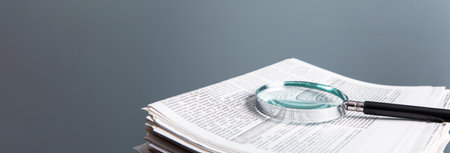 magnifying glass on the newspaperの写真素材