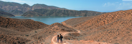couple on road in lake backgroundの写真素材