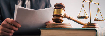 Law and justice concept, lawer holding document with wooden gavelの写真素材