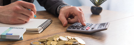 businessman working in office and using calculator on desk. concept finance and accountingの写真素材