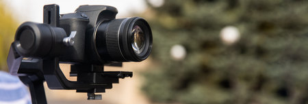 The camera is on a stabilizer for video shootingの写真素材