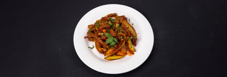 Fried potatoes with onions and broads. View from aboveの写真素材