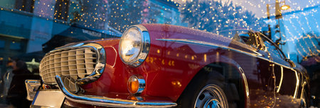 Red retro car on the showcaseの写真素材