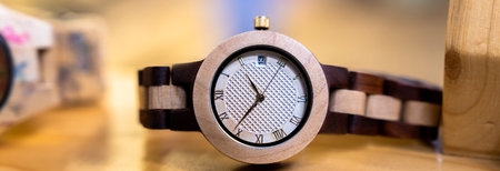 Wooden wristwatch on display for sale