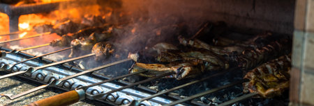 Barbecue is cooked on a large brick grillの写真素材
